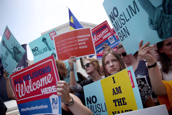 Image: People protest the Supreme Court ruling upholding President Donald Trump's travel ban in Washington