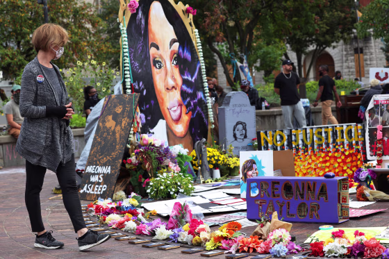 A woman looks at a memorial to Breonna Taylor in Jefferson Square Park on Sept. 26, 2020 in Louisville, Ky.