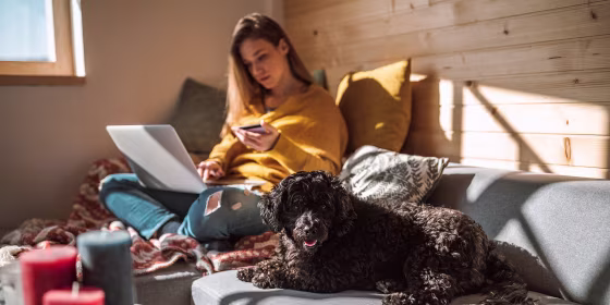 Relaxed Woman Purchasing Online from Living Room