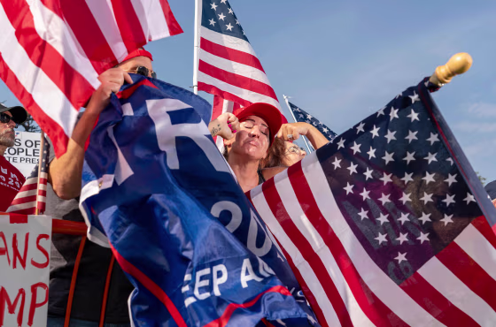 Image: Supporters of President Donald Trump mock anti-Trump motorists during a rally in Beverly Hills, California