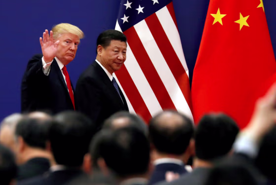 Image: President Donald Trump and China's President Xi Jinping meet business leaders at the Great Hall of the People in Beijing, China