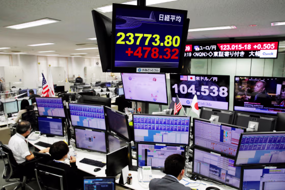 Image: A monitor shows Nikkei stock index at a foreign exchange trading company in Tokyo