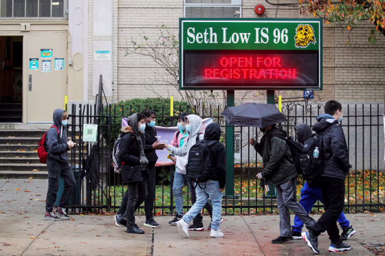 Students exit a school as the spread of coronavirus disease (COVID-19) continues, in Brooklyn, New York