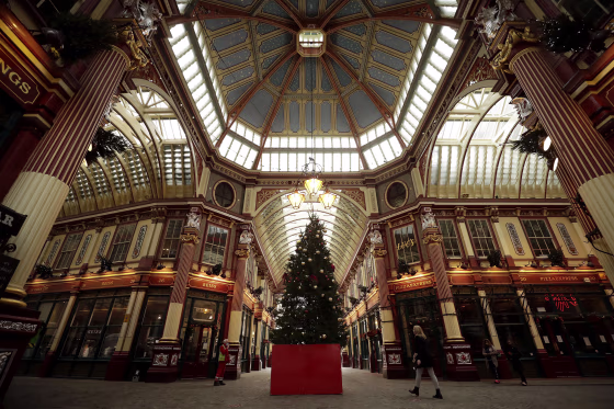 Image: A Christmas tree stands on display in the middle of Leadenhall Market where all the non-essential shops are temporarily closed, during England's second coronavirus lockdown in the City of London financial district of London
