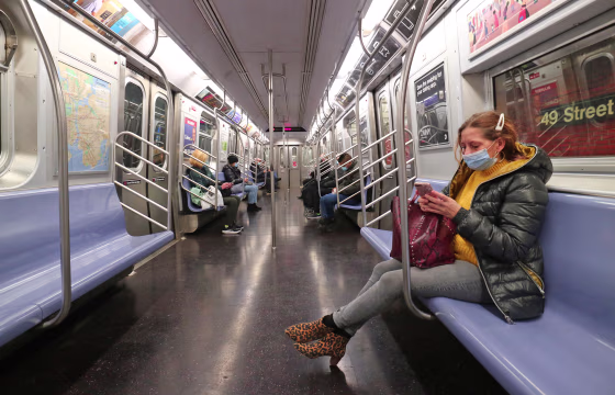 Passengers on a subway train in New York on on Nov. 16, 2020.