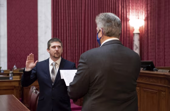 State Del. Derrick Evans, left, takes the oath of office Dec. 14 in Charleston, W.Va.