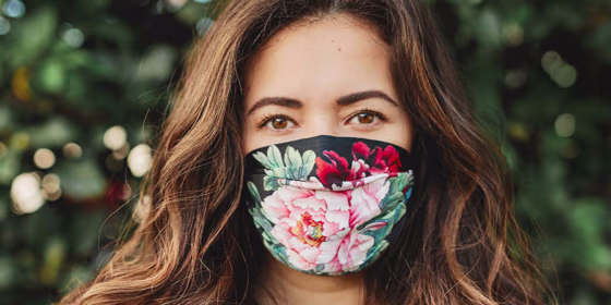 Woman wearing mask from Johnny Was Five-Piece Silk Charmeuse Face Mask Set