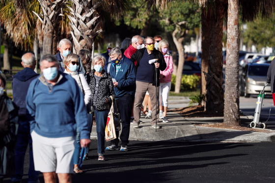 Image: Elderly people line up at a coronavirus disease (COVID-19) vaccination site