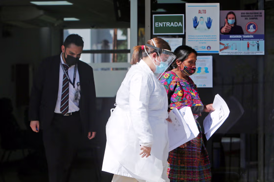 Image: Member of Guatemalan Maya families, who feared their relatives were among 19 bodies found shot and burnt at the weekend in a remote part of northern Mexico, arrive to the Faculty of Medicine for DNA samples to help in the identification, in Guatema