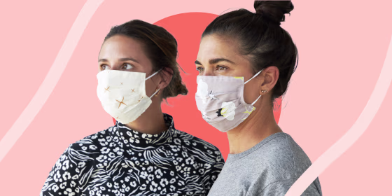 Two women wearing face masks