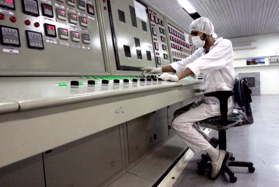 A technician works at the Uranium Conversion Facility just outside the city of Isfahan, Iran, on Feb. 3, 2007.