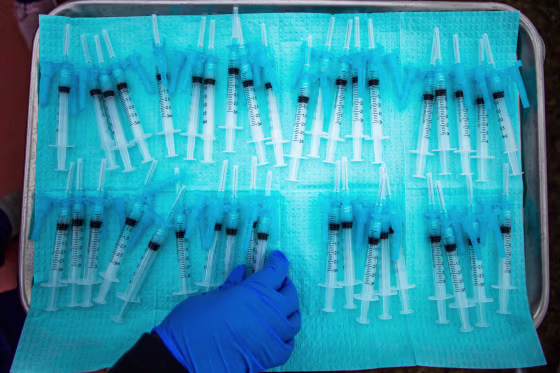 Image: A nurse takes a Moderna Covid-19 vaccines ready to be administered at a vaccination site at Kedren Community Health Center, in South Central Los Angeles on Feb. 16, 2021.