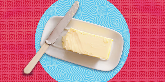 Butter dish on color background