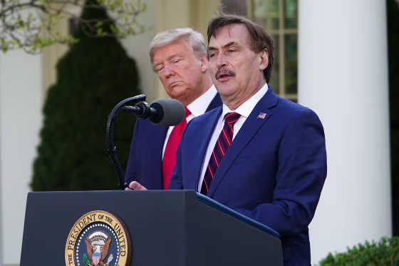 Image: President Donald Trump listens as Michael J. Lindell, CEO of MyPillow Inc., speaks during the daily briefing on the novel coronavirus, Covid-19, in the Rose Garden of the White House on March 30, 2020.