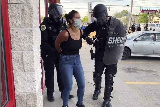 Image: Des Moines Register reporter Andrea Sahouri arrested
