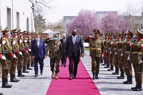 Defense Secretary Lloyd Austin reviews an honor guard at the presidential palace in Kabul, Afghanistan, on March 21, 2021.