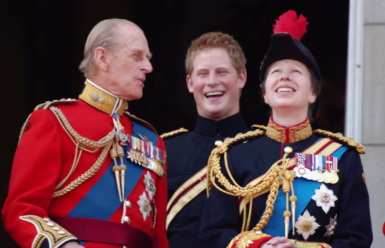 Image: Prince Philip, Duke of Edinburgh, Prince Harry and Princess Anne look on from the balcony during The Queen's Birthday Parade and Trooping The Colour at Buckingham Palace.