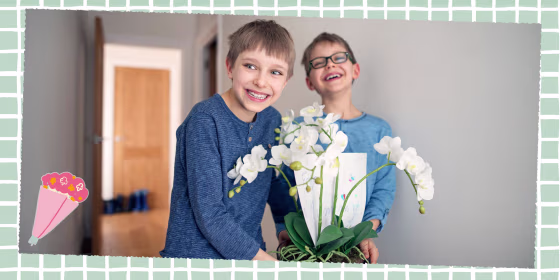 Two Little boys carrying a flower for their mother for Mother's Day