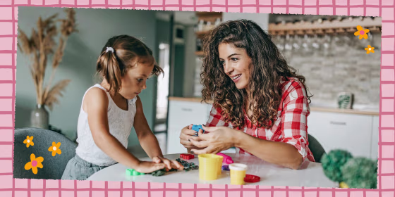 Mother and Daughter sitting at a table playing with a DIY kit