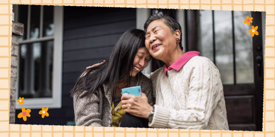 Mother and Daughter hugging while Daughter gives gift