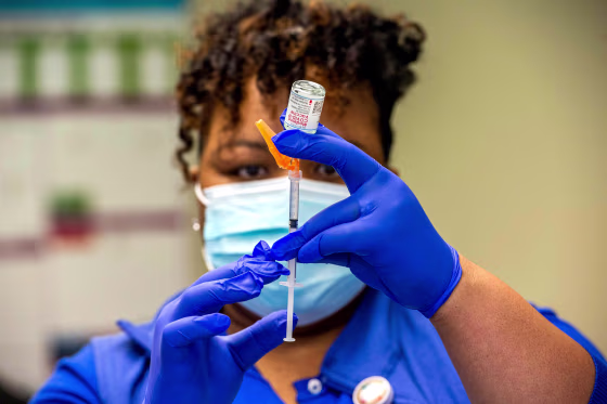 Image: An RN loads syringes with the Moderna Covid-19 Vaccine before heading out to see patients at their homes at Hartford HealthCare at Home in Bloomfield, Conn., on Feb. 12, 2021