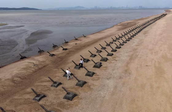 Image: Tourists visiting the anti landing spikes on the coast of Kinmen, the front line islands of Taiwan,