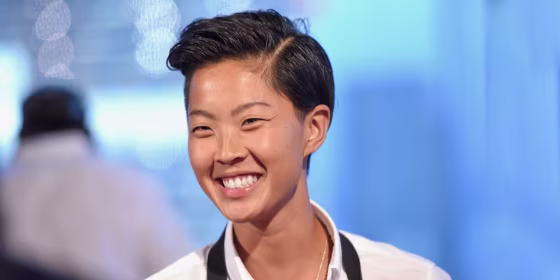 Image of Kristen Kish smiling in the kitchen