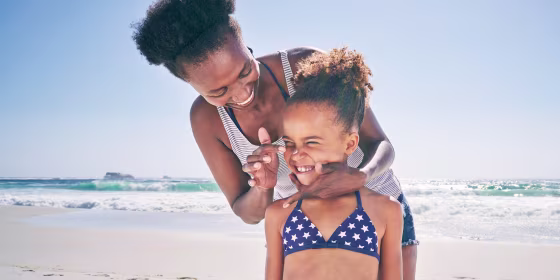 Mother and daughter on beach