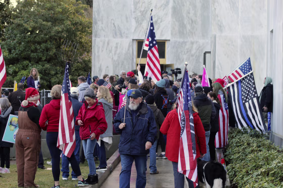 Image: Pro-Trump and anti-mask demonstrators hold a rally outside the Oregon State Capitol on Monday, Dec. 21, 2020, as legislators meet for an emergency session.
