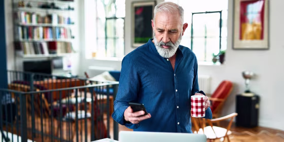 Creative professional remote working and checking phone at home. Shop Amazon small business products and get a $10 credit for Prime Day 2021. Support small businesses with Amazon's \"Spend $10 Get $10\" promotion.