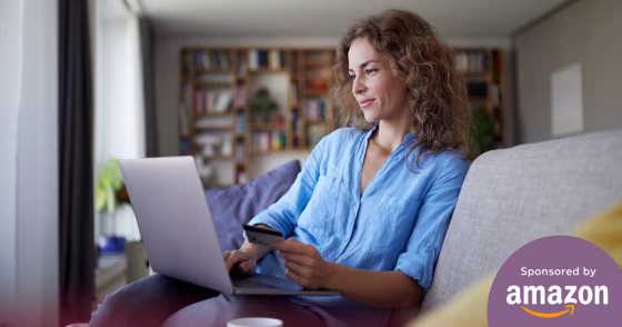Woman shopping on her laptop in her living room