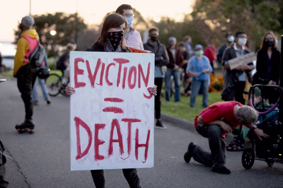 Housing activists gather in front of Gov. Charlie Baker's house on Oct. 14, 2020, in Swampscott, Mass.