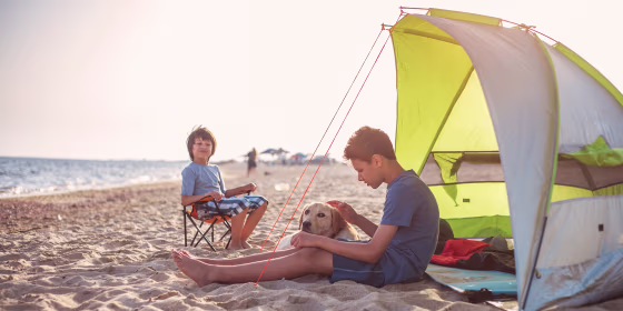 Two boy's camping on the beach