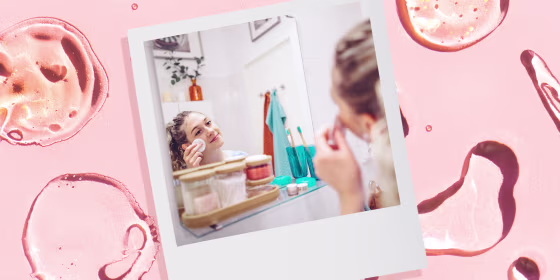 Background of Drops and smears of assorted cosmetic products and a Woman putting on Face Toner while looking in the mirror