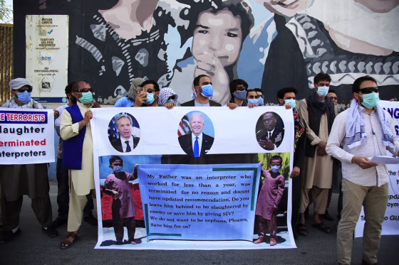 Former Afghan interpreters rally in front of the U.S. Embassy in Kabul on June 25, 2021.