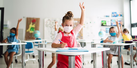 Image of Small children with face mask in school