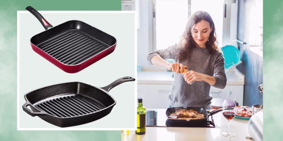 Young smiling woman cooking in the kitchen, adding pepper to the grilled meat and two grill pans