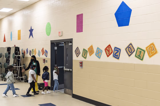 Students are led to their classroom at the start of the day during summer school at Ida Green Elementary in Belzoni, Miss., on June 30, 2021.