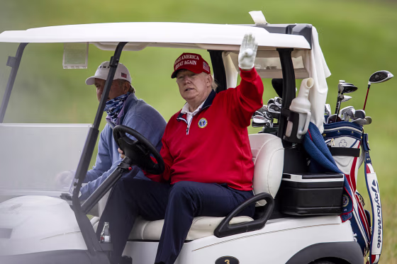 Then-President Donald Trump golfs at Trump National Golf Club on Nov. 27, 2020, in Sterling, Va.