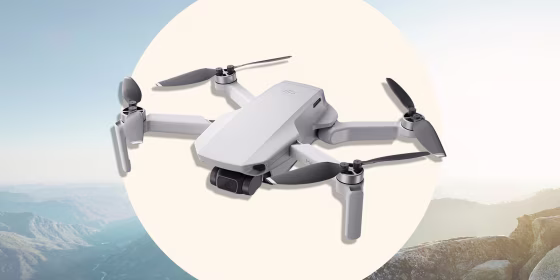 Illustration of a view of sunset over valley hills and the new DJI mini drone
