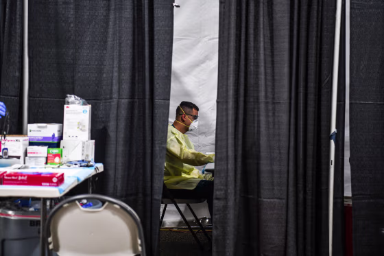 Health care workers work inside the Regeneron Clinic at a monoclonal antibody treatment site in Pembroke Pines, Fla., on Aug. 19, 2021.