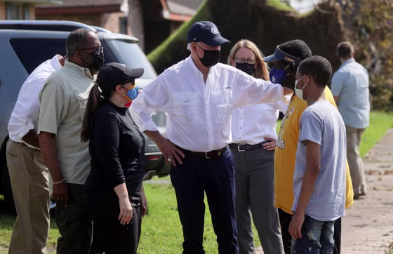 Image: Biden tours a neighbourhood hit by Hurricane Ida