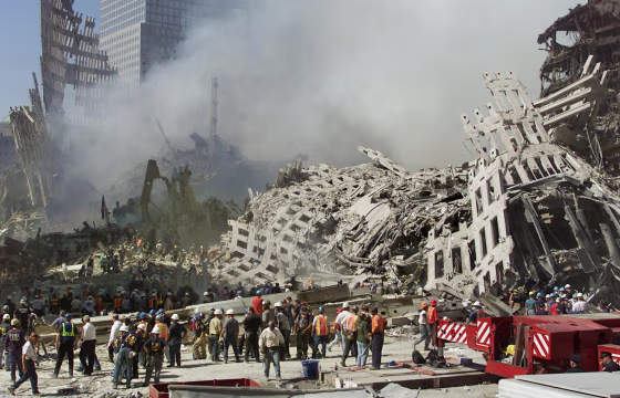 Rescue workers continue their search as smoke rise
