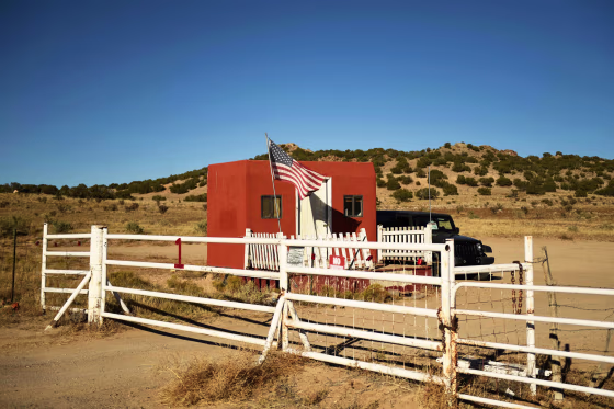 A U.S. flag flies at the entrance to the Bonanza Creek Ranch film set in Sante Fe, N.M., on Oct. 28, 2021.