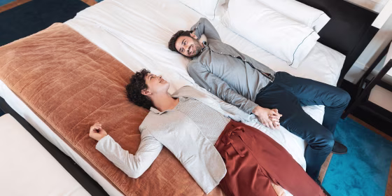 Honeymoon couple relaxing on the bed