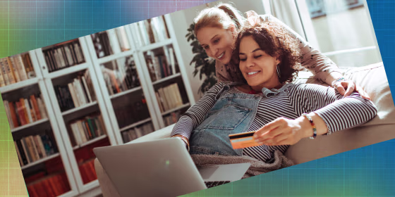 Close up of a female couple online shopping on their laptop