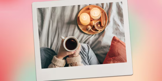 Image of person with mug and candles