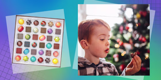 36 Piece Signature Chocolate Collection and a Little boy in his living room on Christmas morning holding a chocolate coin in-between his fingers