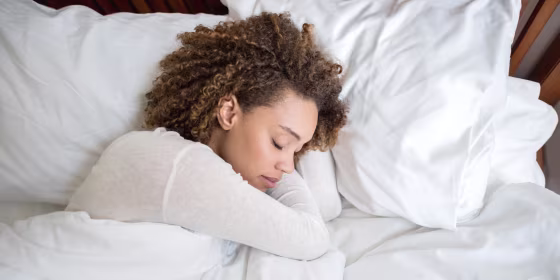 African American woman sleeping in bed