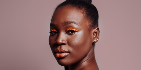 Beauty Portrait Of Black Adult Woman With Orange Eyeshadow